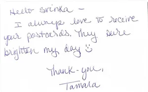 Handwritten note from Tamara saying Svinka's postcards brighten her day